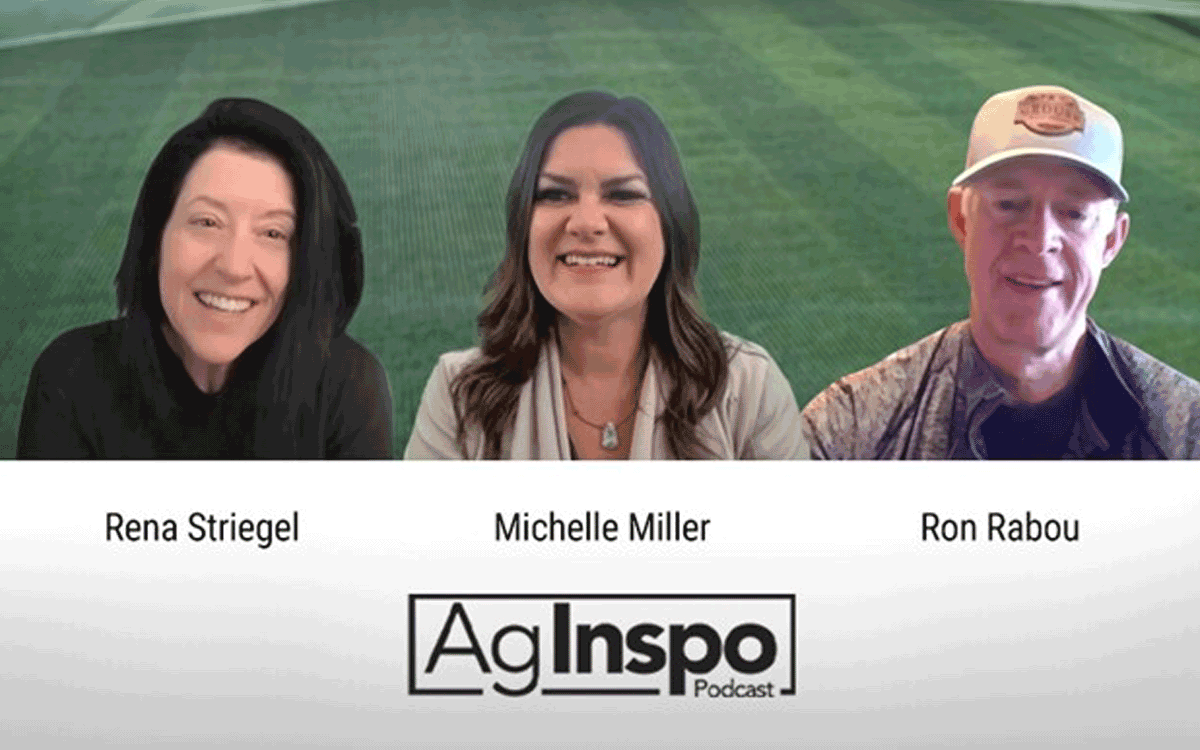 USE_Agweb_3 Three people are smiling for the camera with a field in the background.