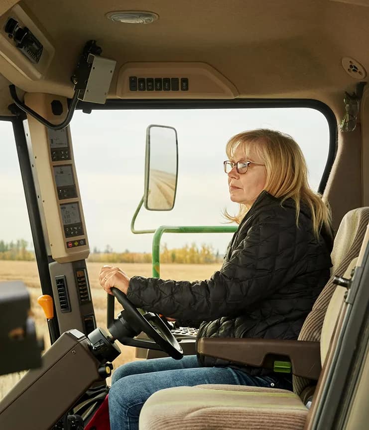 Woman in combine Woman in combine during harvest