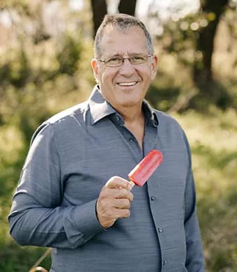 Todd Malecha holding a fruit popsicle